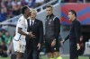 Real Madrid's Vinicius Junior, left, argues with Barcelona's head coach Xavi Hernandez, right, during the La Liga soccer match between Barcelona and Real Madrid at the Olympic Stadium in Barcelona, Spain, Saturday, Oct. 28, 2023. (AP Photo/Joan Monfort)