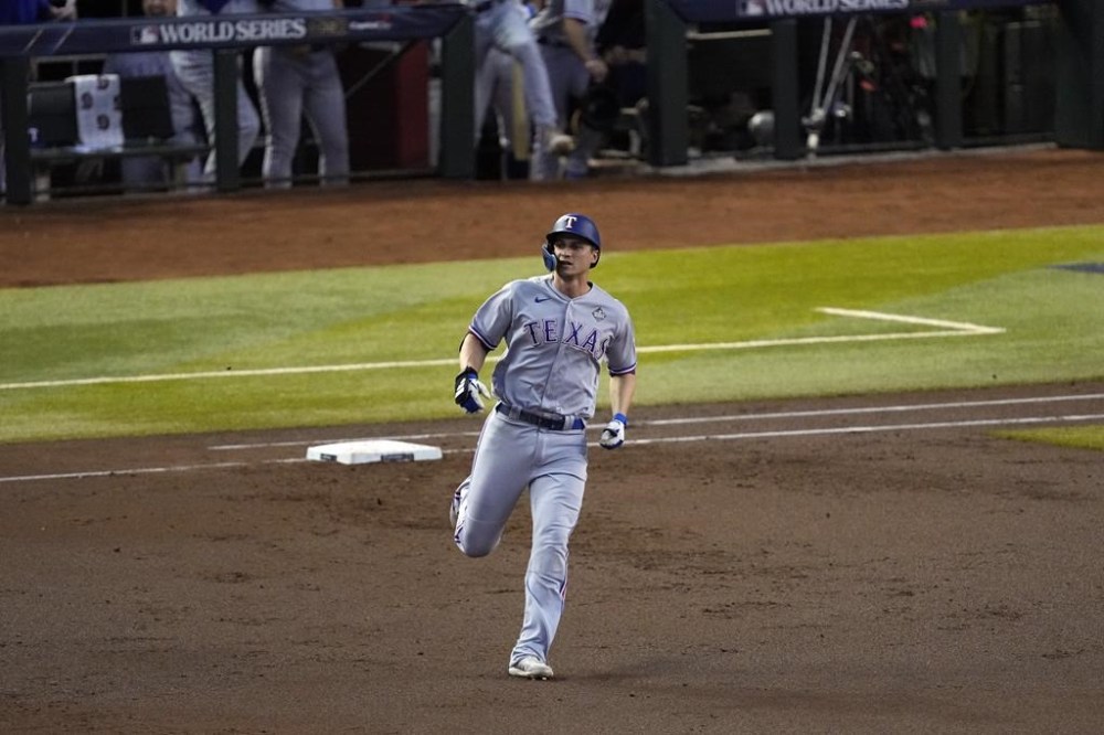 Texas Rangers' Corey Seager runs the bases after hitting a two-run home run against the Arizona Diamondbacks during the second inning in Game 4 of the baseball World Series Tuesday, Oct. 31, 2023, in Phoenix. (AP Photo/Ross D. Franklin)