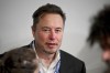 Tesla and SpaceX's CEO Elon Musk attends the first plenary session on of the AI Safety Summit at Bletchley Park, on Wednesday, Nov. 1, 2023 in Bletchley, England. Digital officials, tech company bosses and researchers are converging Wednesday at a former codebreaking spy base near London to discuss and better understand the extreme risks posed by cutting-edge artificial intelligence. (Leon Neal/Pool Photo via AP)
