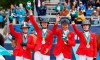 Canada celebrates their silver medal in equestrian jumping at the Santiago 2023 Pan American Games in Quillota, Chile, Wednesday, Nov. 1, 2023. From left to right: Beth Underhill, Amy Millar, Mario Deslauriers, and Tiffany Foster. THE CANADIAN PRESS/HO-Santiago 2023, Photosport, Miguel Campos, *MANDATORY CREDIT*