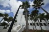 FILE - A police officer stands beside an entrance to the Alto Lee Adams Sr. U.S. Courthouse, Aug. 15, 2023, in Fort Pierce, Fla. A federal judge in Florida has indicated she may delay the start of former President Donald Trump's trial on charges that he hid classified documents at Mar-a-Lago. U.S. District Judge Aileen Cannon questioned prosecutors Wednesday about whether starting the trial in May as scheduled is feasible. (AP Photo/Rebecca Blackwell, File)