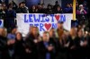 First responders stand on the field as locals cheer after a moment of silence for the victims of the Lewiston shooting, Wednesday, Nov. 1, 2023, prior to a high school football game between Lewiston High School and Edward Little High School in Lewiston, Maine. Locals seek a return to normalcy after the mass shooting on Oct. 25. (AP Photo/Matt York)