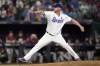 Texas Rangers relief pitcher Will Smith throws against the Arizona Diamondbacks during the ninth inning in Game 1 of the baseball World Series Friday, Oct. 27, 2023, in Arlington, Texas. (AP Photo/Godofredo A. Vásquez)
