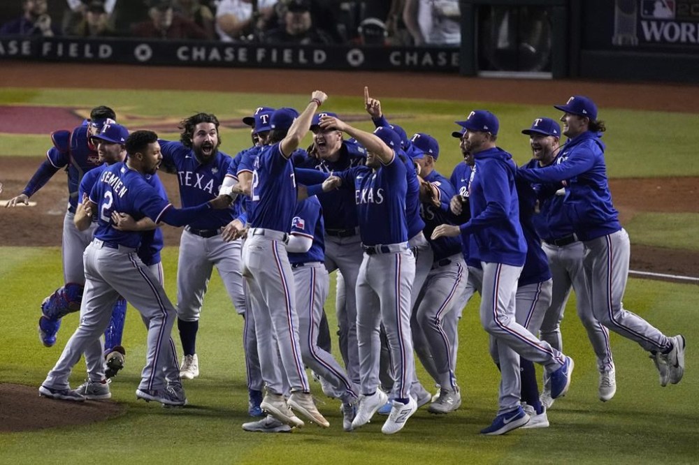 Texas Rangers celebrate after winning Game 5 of the baseball World Series against the Arizona Diamondbacks Wednesday, Nov. 1, 2023, in Phoenix. The Rangers won 5-0 to win the series 4-1. (AP Photo/Ross D. Franklin)