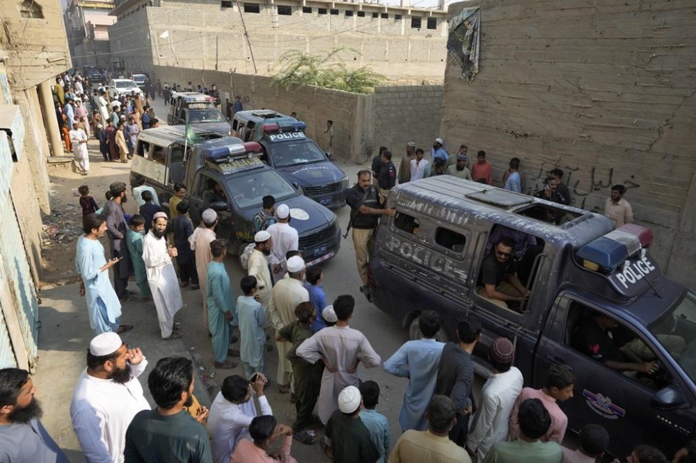 Police officers leave after conducting a search operation against illegal immigrants at a neighborhood of Karachi, Pakistan, Thursday, Nov. 2, 2023. Pakistani security forces rounded up, detained and deported dozens of Afghans who were living in the country illegally, after a government-set deadline for them to leave expired, authorities said. (AP Photo/Fareed Khan)
