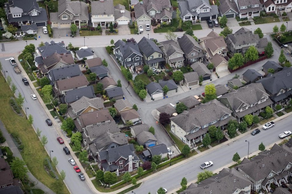 Houses and townhouses are seen in an aerial view, in Langley, B.C., on Wednesday May 16, 2018. THE CANADIAN PRESS/Darryl Dyck