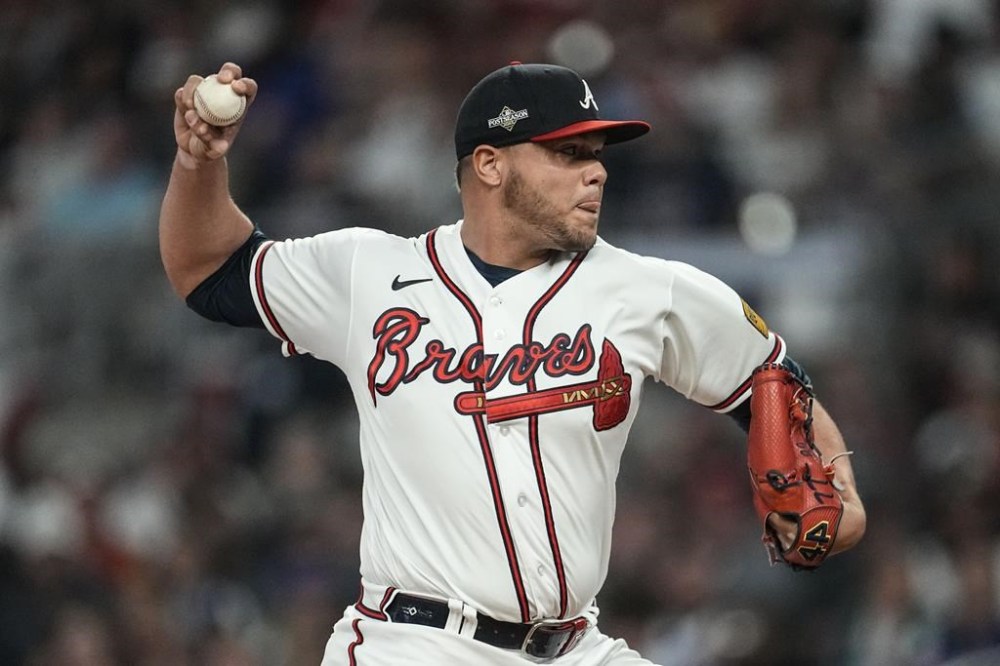 Atlanta Braves relief pitcher Joe Jimenez (77) works in the sixth inning of Game 2 of a baseball NL Division Series against the Philadelphia Phillies, Monday, Oct. 9, 2023, in Atlanta. (AP Photo/John Bazemore)