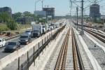 A Montreal suburb will have to pay thousands of dollars in compensation to around 300 residents who say they've suffered from years of unreasonable traffic noise, a Quebec Superior Court judge has ruled. Traffic is seen on a road as a train rolls along the track in between lanes of a freeway during a media tour of the Reseau express metropolitain (REM) in Brossard, Que. on Thursday, June 10, 2021. THE CANADIAN PRESS/Paul Chiasson