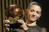 FC Barcelona's and Spain's national team's midfielder Aitana Bonmati holds the trophy as she receives the 2023 Women's Ballon d'Or award during the 67th Ballon d'Or (Golden Ball) award ceremony at Theatre du Chatelet in Paris, France, Monday, Oct. 30, 2023. (AP Photo/Michel Euler)