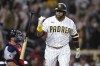 FILE - San Diego Padres' Nelson Cruz, right, tosses his bat after hitting a solo home run during the eighth inning of a baseball game against the Cleveland Guardians, June 14, 2023, in San Diego. Cruz, a seven-time All-Star and 19-year Major League Baseball veteran, says he is retiring after 19 seasons. Cruz, who is 43, said on Adam Jones' podcast Friday, Nov. 2, 2023, that he plans to play this winter in the Dominican Professional Baseball League. (AP Photo/Denis Poroy, File)