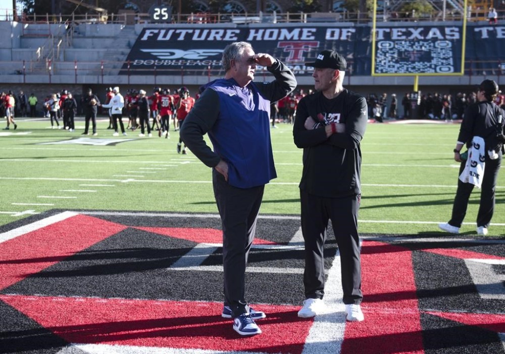 TCU coach Sonny Dykes, left, and Texas Tech coach Joey McGuire meet before an NCAA college football game Thursday, Nov. 2, 2023, in Lubbock, Texas. (Annie Rice/Lubbock Avalanche-Journal via AP)