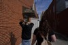 Jesse Johnson of the Family Resource Center, right, walks with client Tyler Baker to the Hancock County Adult Probation office for a random drug test in Findlay, Ohio, Thursday, Oct. 12, 2023. Earlier this year, Johnson started a job with the Family Resource Center, the same organization that employed the peer support worker who was so instrumental in her own early recovery. (AP Photo/Carolyn Kaster)