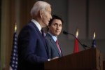 Canadian Prime Minister Justin Trudeau listens as President Joe Biden speaks during a news conference Friday, March 24, 2023, in Ottawa, Canada. (AP Photo/Andrew Harnik)