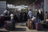 Canadians remained off the list of approved foreign citizens to exit the Gaza Strip as Canada's minister of foreign affairs reconfirmed that Canadians and their families will be able to leave in the coming days. Palestinians wait to cross into Egypt at Rafah, Gaza Strip, on Wednesday, Nov. 1, 2023. THE CANADIAN PRESS/AP/Fatima Shbair
