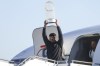 Texas Rangers' Marcus Semien hoists the Commissioner's Trophy next to pitcher José Leclerc upon the arrival of the baseball team at Dallas Love Field on Thursday, Nov. 2, 2023, in Dallas, the day after their World Series win over the Arizona Diamondbacks. (Shafkat Anowar/The Dallas Morning News via AP)