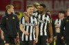 Newcastle's Matt Ritchie, front left, and Newcastle's Callum Wilson celebrate at the end of EFL Cup fourth round soccer match between Manchester United and Newcastle at Old Trafford stadium in Manchester, England, Wednesday, Nov. 1, 2023. (AP Photo/Dave Thompson)