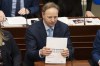 Finance Minister Allan MacMaster arranges his documents at the Nova Scotia legislature in Halifax on Thursday, March 23, 2023. MacMaster says his province and several others made it clear during a virtual call with federal Finance Minister Chrystia Freeland that the federal carbon pricing scheme should be eliminated.THE CANADIAN PRESS/Darren Calabrese