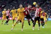 Wolverhampton Wanderers' Sasa Kalajdzic, left, battles for the ball with Sheffield United's Oliver Norwood and Auston Trusty, during the English Premier League soccer match between Sheffield United and Wolverhampton Wanderers, at Bramall Lane, in Sheffield, England, Saturday, Nov. 4, 2023. (Nick Potts/PA via AP)