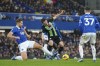Everton's James Tarkowski, left, and Brighton and Hove Albion's Billy Gilmour battle for the ball during the English Premier League soccer match between Everton and Brighton & Hove Albion at Goodison Park, Liverpool, England, Saturday Nov. 4, 2023. (Peter Byrne/PA via AP)