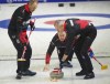 Team Canada skip Brad Gushue makes a shot as lead Geoff Walker, left, and second E.J. Harnden sweep as they take on Taiwan at the Pan Continental Curling Championship in Kelowna, B.C. in this Wednesday, Nov. 1, 2023 handout photo. THE CANADIAN PRESS/HO, Curling Canada, Michael Burns *MANDATORY CREDIT*