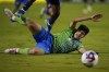 Seattle Sounders midfielder Obed Vargas reacts as the ball gets away while being challenged by FC Dallas defender Nkosi Tafari, top, during the second half in Game 2 of a first round MLS playoff soccer match, Saturday, Nov. 4, 2023, in Frisco, Texas. FC Dallas won 3-1. (AP Photo/Julio Cortez)