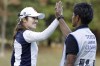 Japanese golfer Mone Inami, left, celebrates with her caddie on the 17th hole during the third round of the LPGA's Japan Classic on Saturday, Nov. 4, 2023 at the Taiheiyo Club in Omitama city, Ibaraki prefecture, north central Japan. Inami shot a 3-under 69 on Sunday, Nov. 5, to win the LPGA's Japan Classic by one shot over Seon Woo Bae of South Korea and Shiho Kuwaki of Japan.(Kyodo News via AP)