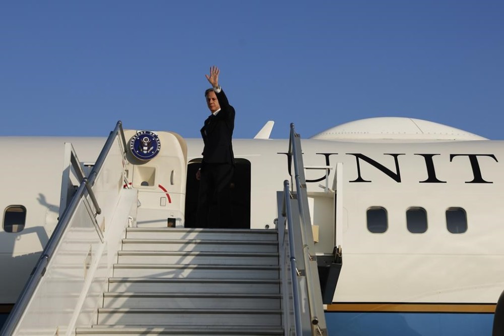 U.S. Secretary of State Antony Blinken waves as he boards his plane to depart after meetings, amid the conflict between Israel and Hamas, in Amman, Jordan, Sunday, Nov. 5, 2023. (Jonathan Ernst/Pool Photo via AP)