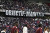 Lyon' supporters hold a banner reading 'Objective: maintain' before the French League One soccer match between Lyon and Metz in Decines, near Lyon, central France, Sunday, Nov. 5, 2023. (AP Photo/Laurent Cipriani)