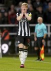Newcastle United's Anthony Gordon reacts after being booked for dissent, during the English Premier League soccer match between Newcastle United and Arsenal at St. James' Park, in Newcastle upon Tyne, England, Saturday, Nov. 4, 2023. (Owen Humphreys/PA via AP)