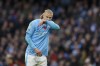 Manchester City's Erling Haaland wipes his face during the English Premier League soccer match between Manchester City and Bournemouth at the Etihad stadium in Manchester, England, Saturday, Nov. 4, 2023. (AP Photo/Dave Thompson)