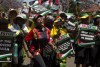 FILE - Pro-Palestinian supporters demonstrate at the entrance to the Israeli embassy in Pretoria, South Africa, on Oct. 20, 2023. South Africa's government has recalled Monday Nov. 6, 2023 its ambassador and diplomatic mission to Israel in condemnation of the bombardment of the Gaza Strip, calling it “a genocide”. (AP Photo/Denis Farrell, File)