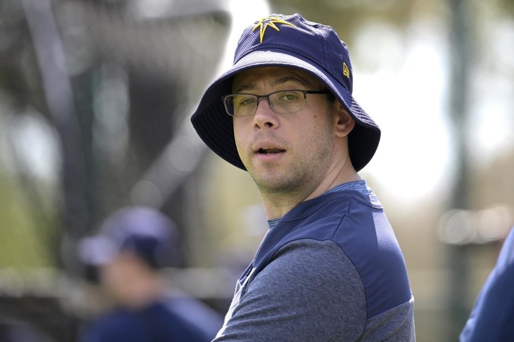 FILE - Tampa Bay Rays general manager Peter Bendix watches during practice at spring training baseball camp, Monday, Feb. 20, 2023, in Kissimmee, Fla. The Miami Marlins are hiring Tampa Bay general manager Peter Bendix to head their baseball operations department, a person with knowledge of the decision said Sunday night, Nov. 5.(AP Photo/Phelan M. Ebenhack, File)