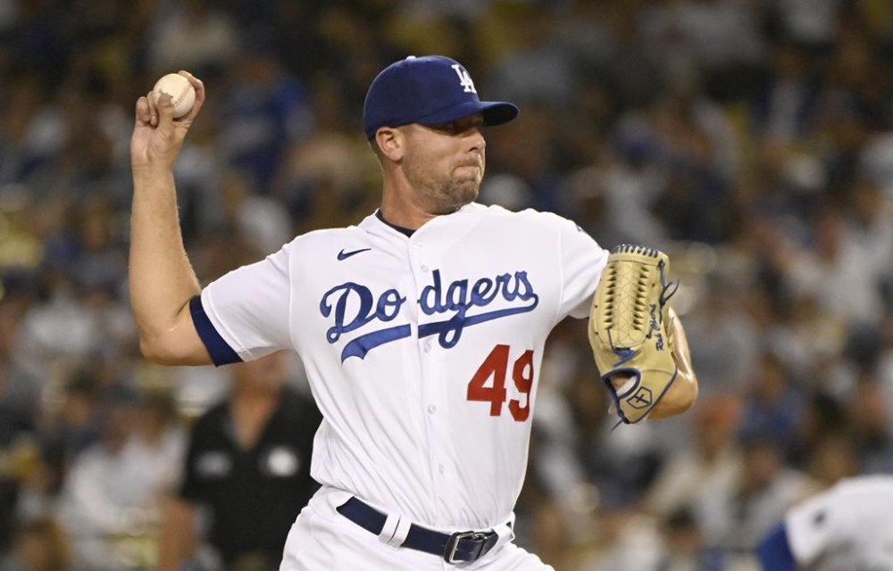 FILE - Los Angeles Dodgers' Blake Treinen pitches against the San Francisco Giants during the seventh inning of a baseball game Monday, Sept. 5, 2022, in Los Angeles. The Dodgers, Monday, Nov. 6, 2023, exercised their 2024 club option on reliever Blake Treinen. (AP Photo/John McCoy, File)