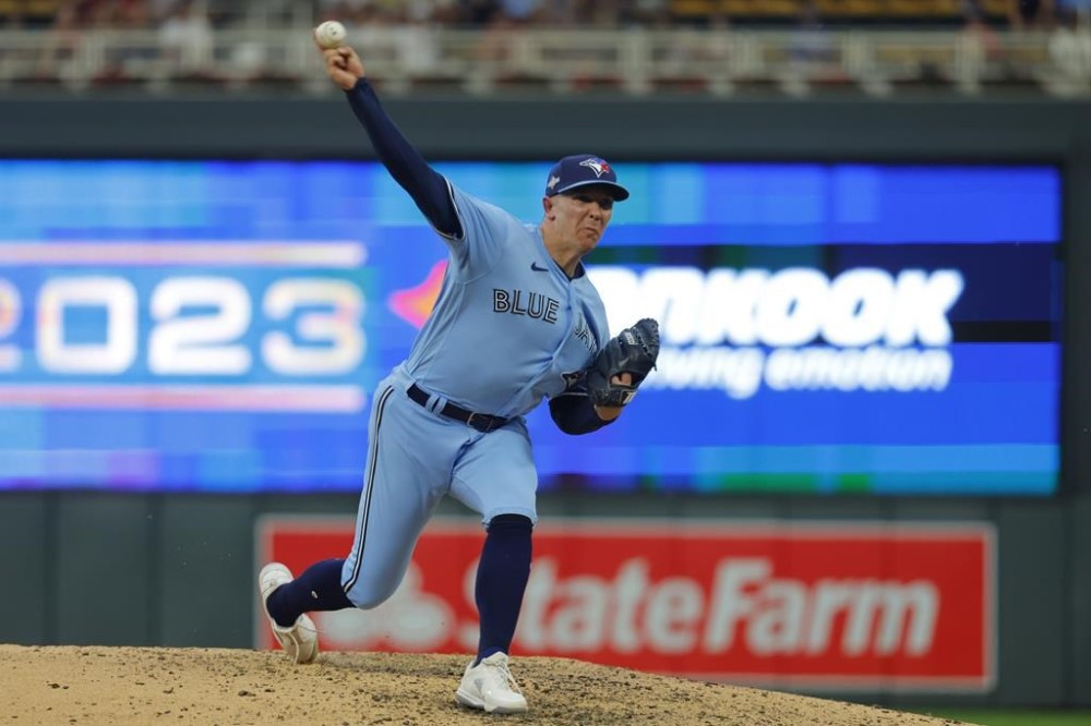 FILE - Toronto Blue Jays relief pitcher Chad Green throws to a Minnesota Twins batter during the sixth inning in Game 1 of an AL wild-card baseball playoff series Tuesday, Oct. 3, 2023, in Minneapolis. The Blue Jays exercised a club option on reliever Chad Green that guarantees the right-hander $21 million for 2024 and 2025. (AP Photo/Bruce Kluckhohn, File)