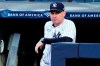 FILE - New York Yankees bench coach Carlos Mendoza watches the first inning of a baseball game against the San Diego Padres, Friday, May 26, 2023, in New York. The New York Mets are hiring Yankees bench coach Carlos Mendoza as their manager, according to a person familiar with the decision. The person spoke to The Associated Press on condition of anonymity Monday, Nov. 6, because the move had not been announced. (AP Photo/Frank Franklin II, File)
