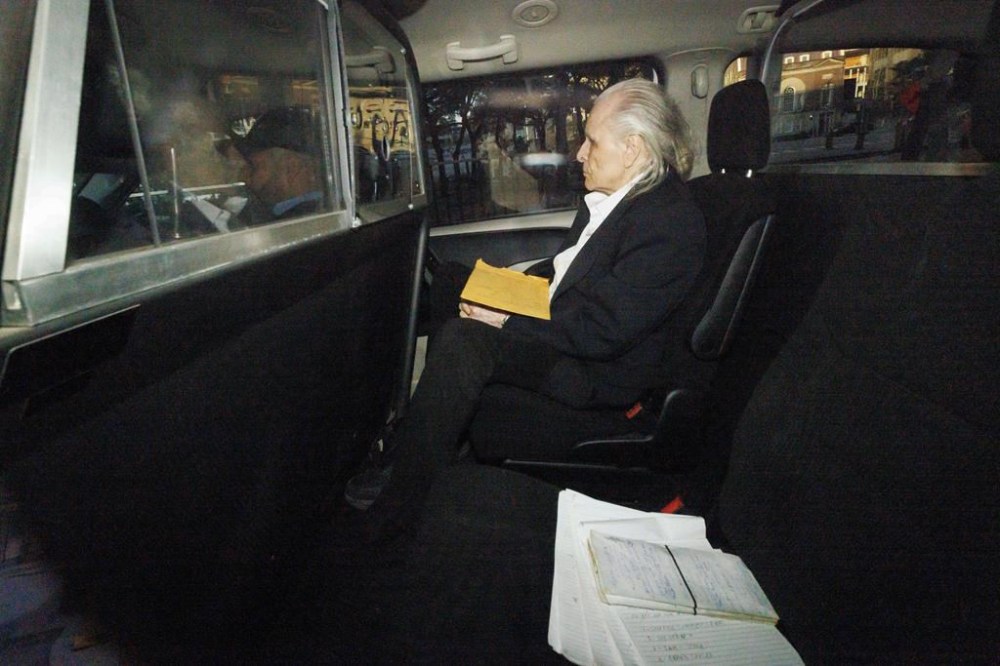 The jury in Peter Nygard's sexual assault trial is expected to hear closing arguments from the Crown and defence lawyers today. Seen through a police vehicle window, Nygard arrives to a Courthouse in Toronto, Tuesday, Oct. 3, 2023. THE CANADIAN PRESS/Cole Burston