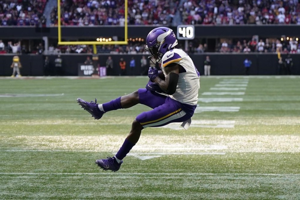 Minnesota Vikings wide receiver Brandon Powell (4) makes a catch in the end zone for a touchdown against the Atlanta Falcons during the second half of an NFL football game Sunday, Nov. 5, 2023, in Atlanta. (AP Photo/Mike Stewart)