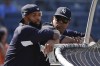 FILE -New York Giants wide receiver Odell Beckham Jr., left, watches batting practice with New York Yankees hitting coach Marcus Thames before a baseball game between the Yankees and the Boston Red Sox, Friday, June 29, 2018, in New York. Marcus Thames was hired Tuesday, Nov. 7, 2023 as their hitting coach of the Chicago White Sox, who lured him from a similar job with the Los Angeles Angels.(AP Photo/Julie Jacobson, File)