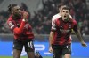 AC Milan's Rafael Leao celebrates with AC Milan's Christian Pulisic, right, after scoring a goal with an overhead kick during the Champions League group F soccer match between AC Milan and Paris Saint Germain at the San Siro stadium in Milan, Italy, Tuesday, Nov. 7, 2023. (AP Photo/Antonio Calanni)