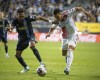 Philadelphia Union's José Andres Martínez (8) battles New England Revolution's Bobby Wood (17) during an MLS playoff soccer game, Saturday, Oct. 28, 2023, in Philadelphia. (AP Photo/Joe Lamberti)