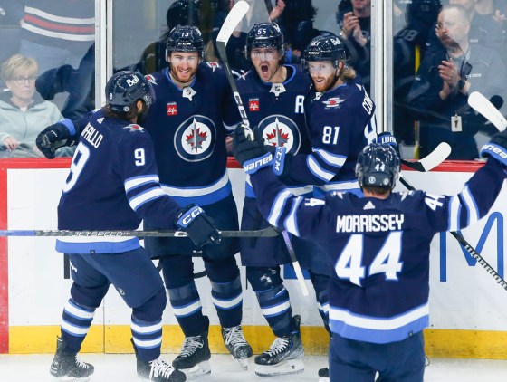 Winnipeg Jets' Alex Iafallo (9), Gabriel Vilardi (13), Mark Scheifele (55), Kyle Connor (81) and Josh Morrissey (44) celebrate Scheifele's goal against the Florida Panthers during first period NHL action in Winnipeg on Saturday. (John Woods / The Canadian Press)