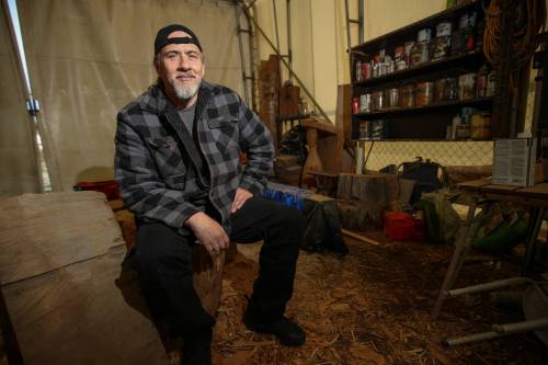 Trevor Hagan / Winnipeg Free Press
                                Robert Sanderson in the &lsquo;Carving Shack,&rsquo; a tent set up for wood carving on Vancouver Island. Since serving his prison sentence, he spends his time immersed in artwork.