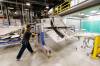 MIKE DEAL / WINNIPEG FREE PRESS
                                Boeing employee takes a freshly painted landing gear door for a Boeing 787 out of a painting bay. Boeing Winnipeg broke ground Wednesday morning on a $20 million, 12,000 square-foot expansion of its Winnipeg manufacturing plant to more efficiently meet the growing demand for composite airplane parts.