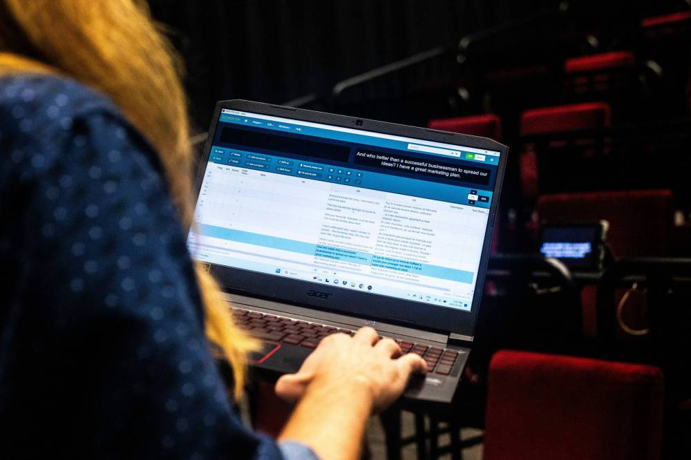 MIKAELA MACKENZIE / WINNIPEG FREE PRESS
Jack Maier translates French scripts into English for live performances so audience members can read along with the dialogue.