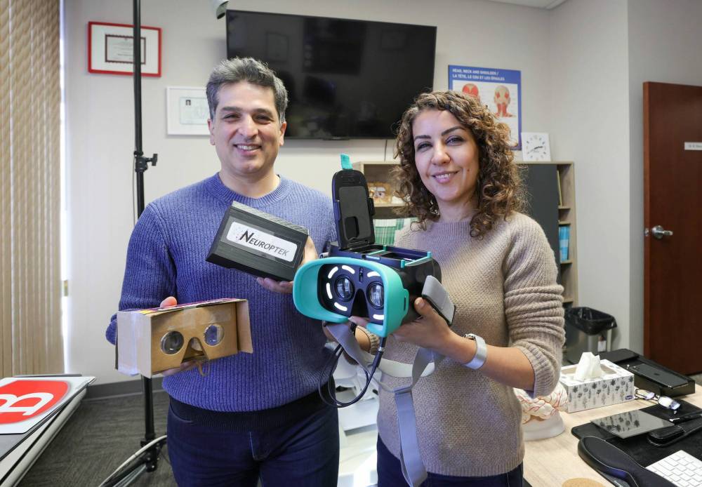 RUTH BONNEVILLE / WINNIPEG FREE PRESS
CEO Dr. Neda Anssari (right) and her husband, Dr. Behzad Mansouri COO of Neuroptek, holding their invention called EyeMirage.