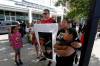 PHIL HOSSACK / WINNIPEG FREE PRESS
                                Felix Thompson accompanied his sister Erica Thompson and their family holds a portrait of his brother Sean Friday night. Sean died in police custody a week ago. See Nicholas’ story. - July 5, 2019.