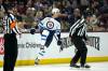 Jets rugged defenceman Brenden Dillon celebrates after bulging the twine for one of his two goals against the Arizona Coyotes. (Ross D. Franklin / The Associated Press)