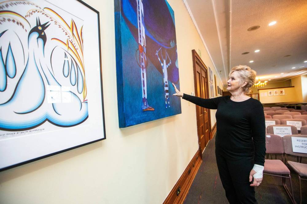 MIKAELA MACKENZIE / WINNIPEG FREE PRESS
                                Former speaker Myrna Driedger looks at Untitled-07.93 by Linus Woods in the collection of Indigenous art that she gathered from various offices throughout the building to display in the Golden Boy room at the Manitoba Legislative Building on Thursday.