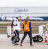 MIKAELA MACKENZIE / WINNIPEG FREE PRESS
                                Adam Bighill boarded the plane to Hamilton for the Grey Cup wearing a walking boot on his right leg.