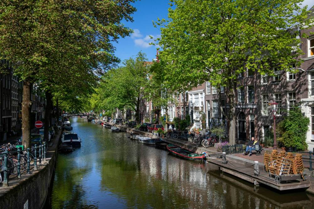 Ilvy Njiokiktjien for The Washington Post
Canals in the city centre of Amsterdam. Amsterdam has taken a two-pronged approach to sustainability by adopting ‘doughnut economics.’